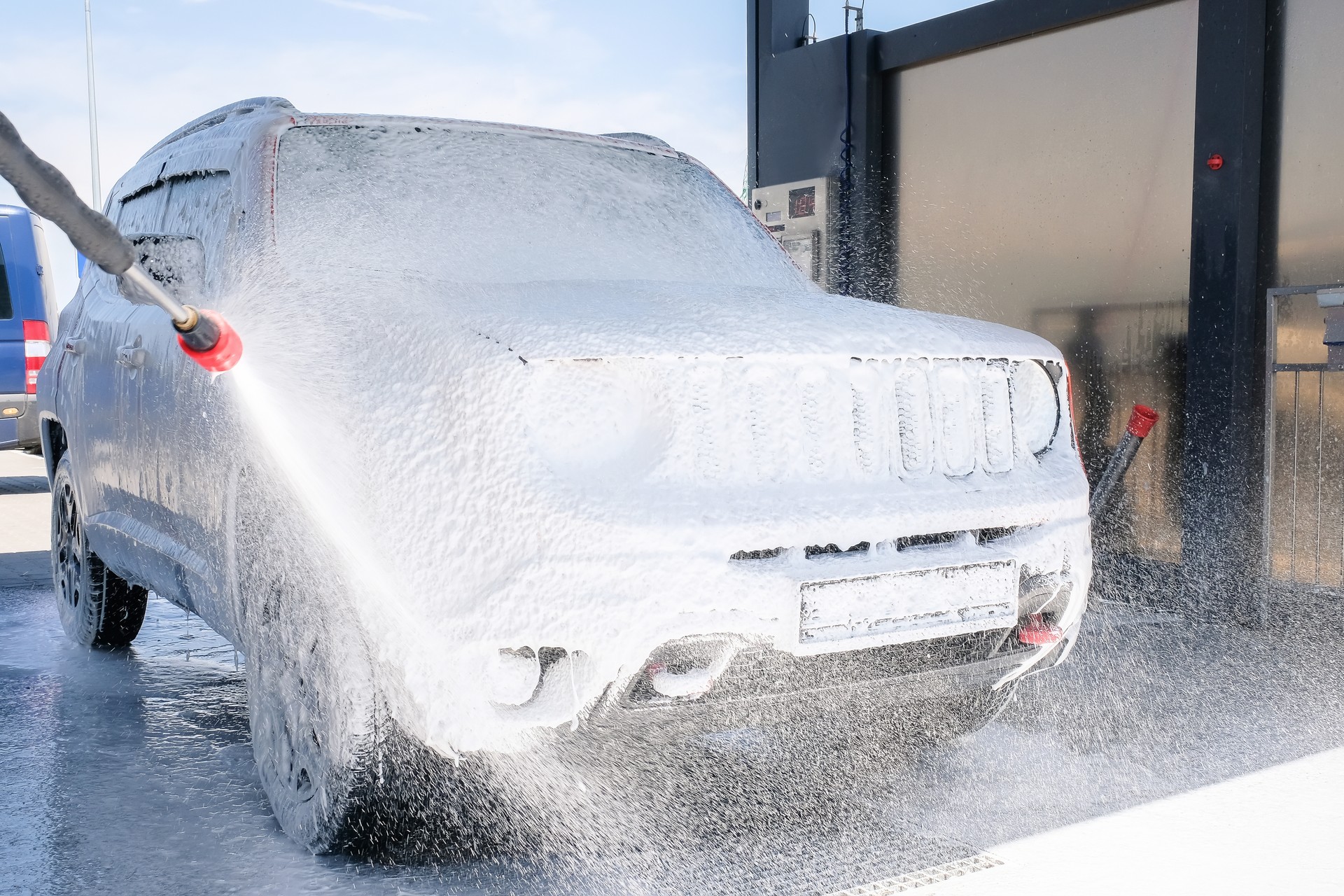 Car in the foam at the car wash. Manual car wash