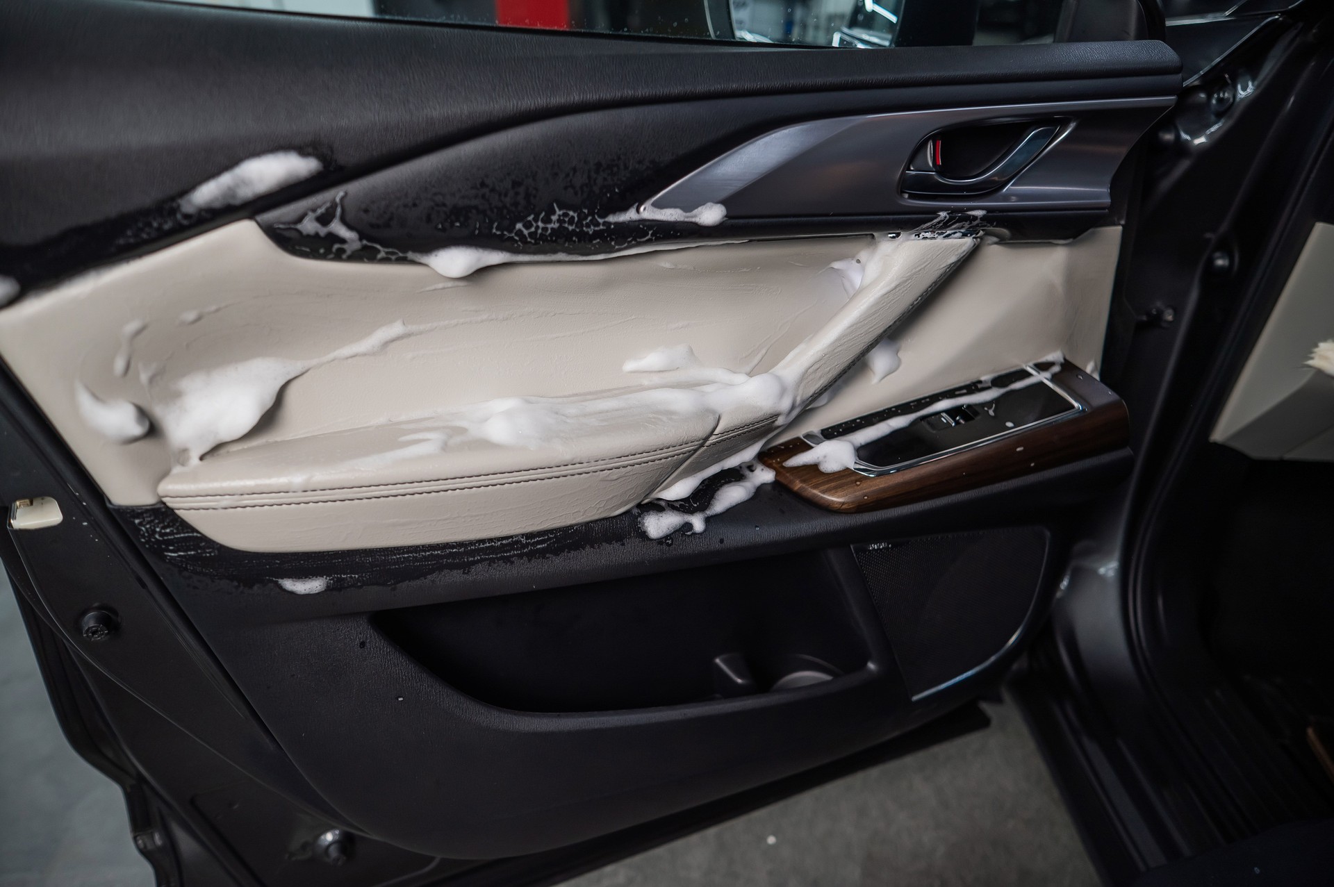 Car door trim in cleaning foam.